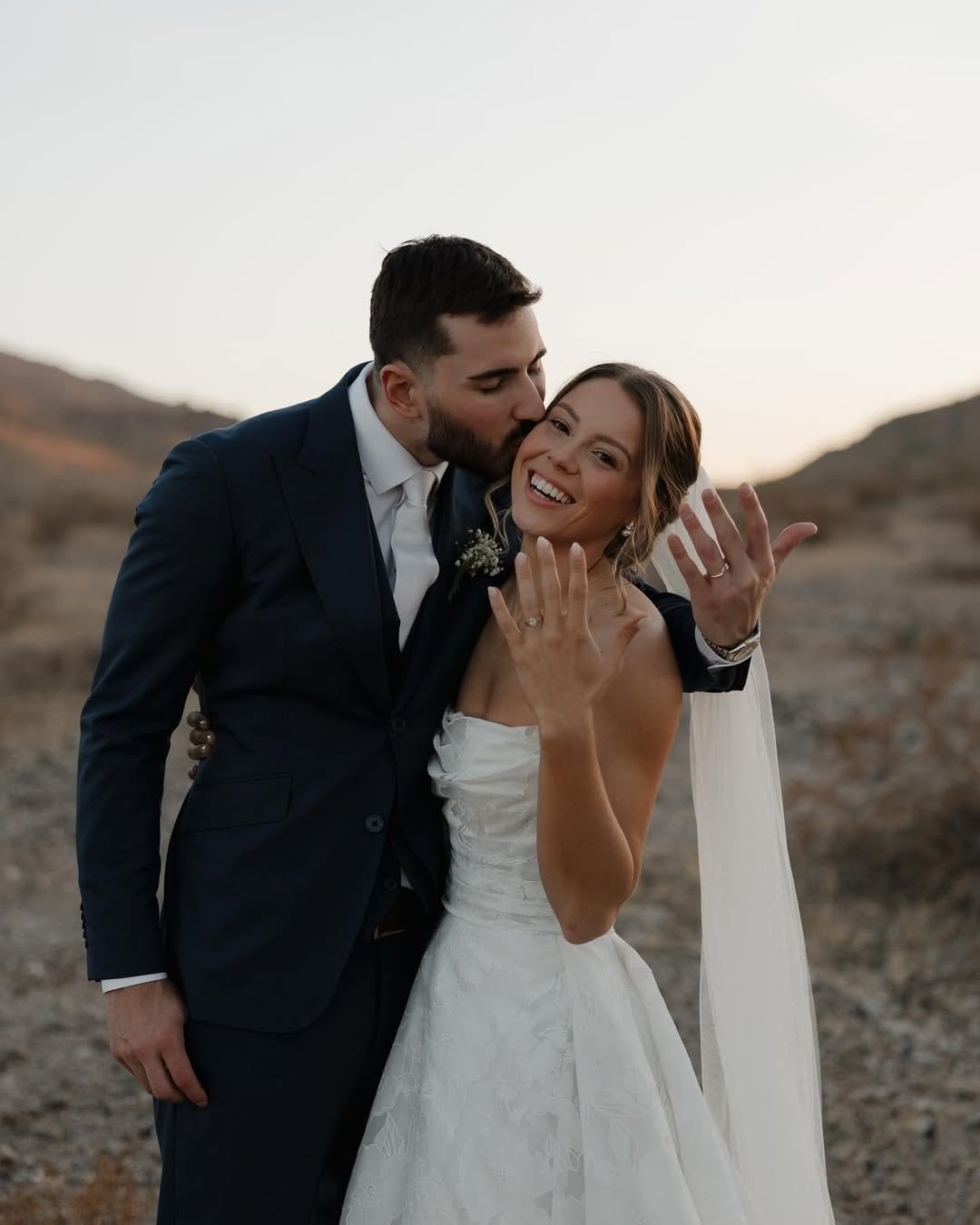 Bride and groom in custom wedding suit